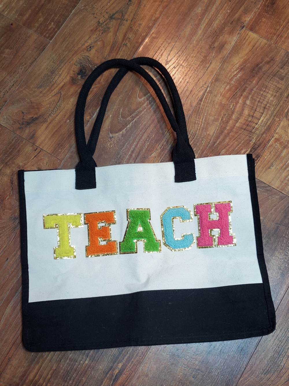 Amazon Canvas TEACH Tote Bag in White with Black Trim and Multicolor Letters